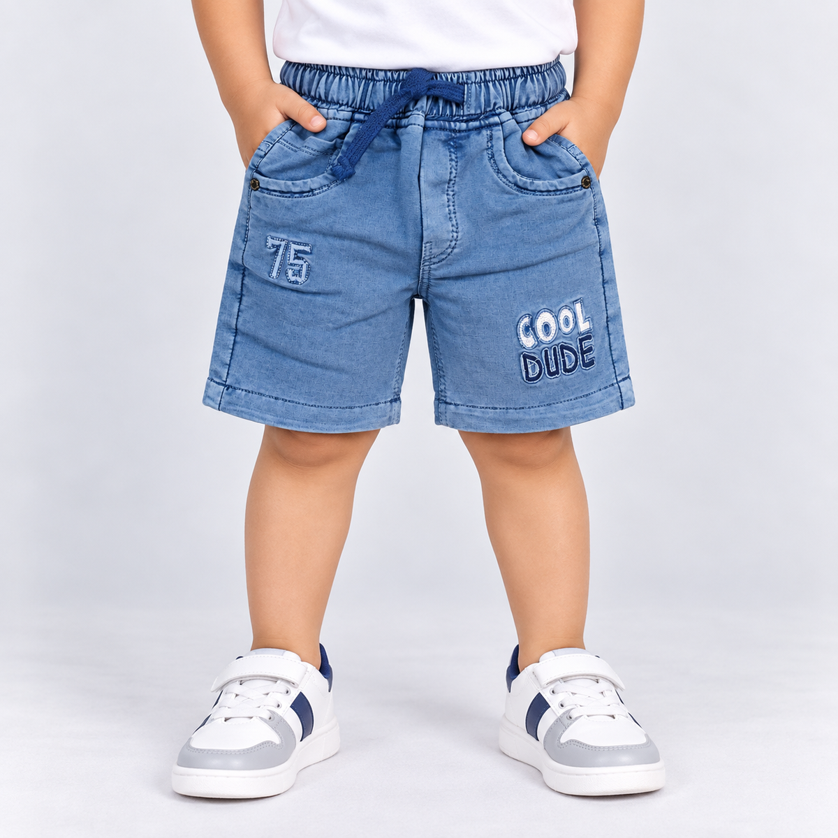 Taxi Junior boys blue denim shorts with elastic waist, drawstring and Cool Dude printed details | Cutypi