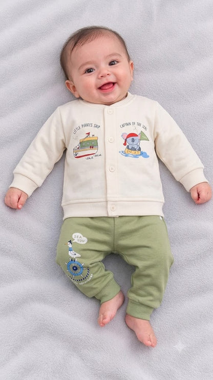 Cucumber baby  cream fleece winter top with cute pirate ship and sailor elephant prints, paired with olive green jogger pants featuring a seagull and ship wheel graphic
