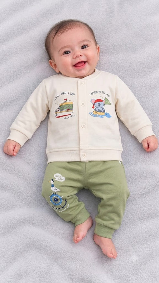 Cucumber baby  cream fleece winter top with cute pirate ship and sailor elephant prints, paired with olive green jogger pants featuring a seagull and ship wheel graphic