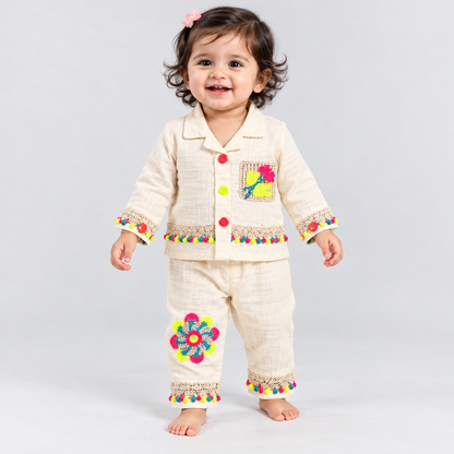Lanya baby girls cream co-ord set with colourful floral crochet appliqué, button-down top and matching pants with pom-pom lace details