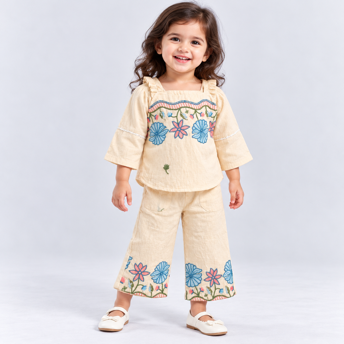 Tickletts baby girls cream three-piece outfit with floral embroidered sleeveless top, full sleeve inner blouse and matching wide-leg pants