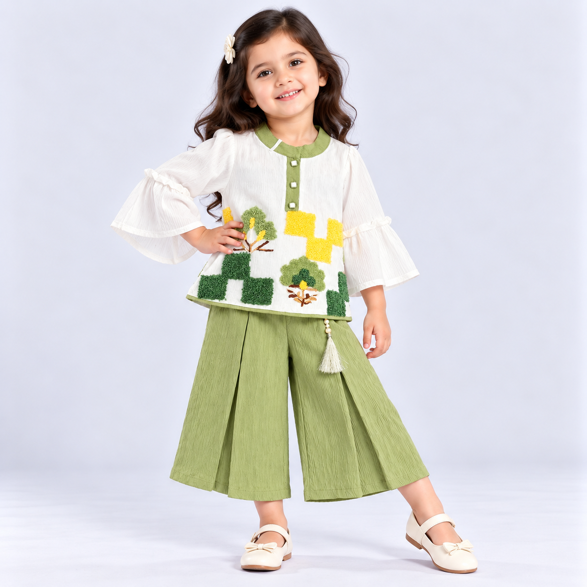 Auli girls white top with green palazzo set featuring embroidered tree details and stylish flared sleeves