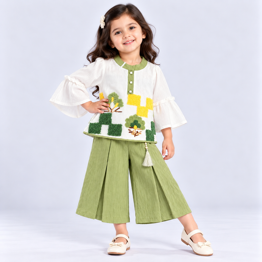 Auli girls white top with green palazzo set featuring embroidered tree details and stylish flared sleeves
