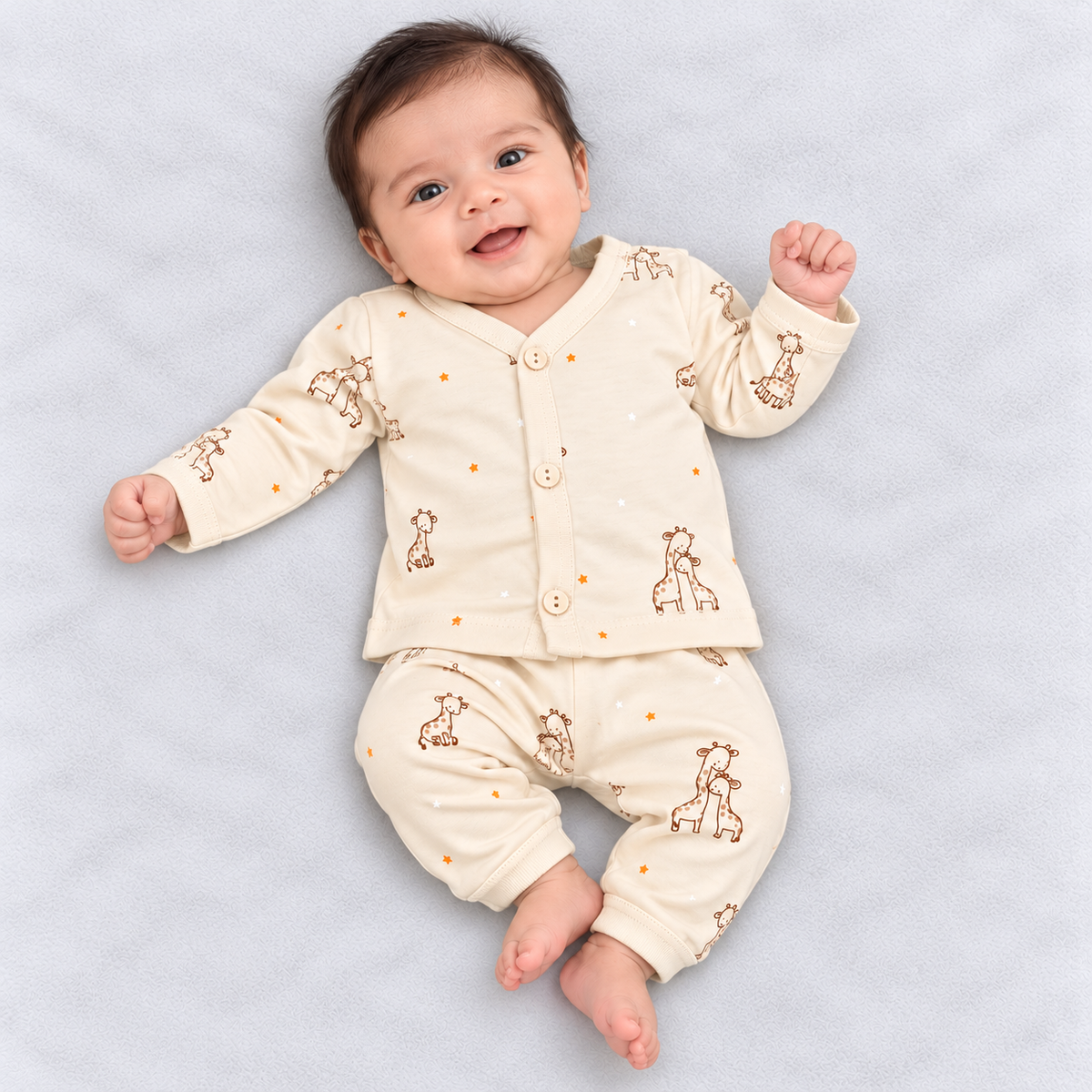 Zero Cream baby unisex cotton co-ord set with brown giraffe prints, orange and white stars, button-front top and matching pants