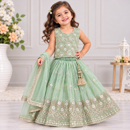 Cutypi girls mint green embroidered lehenga choli with sleeveless floral embellished blouse, flared lehenga skirt, gold-tone sequin work and matching dupatta